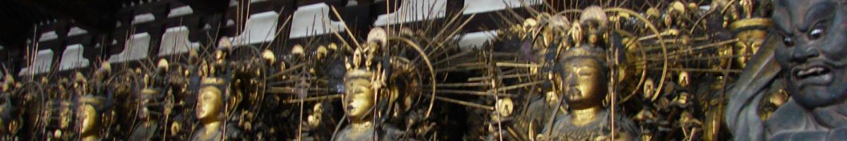 Line of large gold Buddhist statues