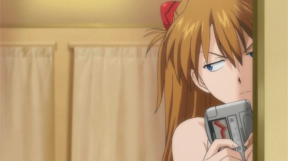 Asuka from Evangelion with a WonderSwan and the game Gunpey